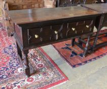 A small 18th century and later oak two drawer low dresser, width 133cm, depth 55cm, height 85cm
