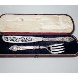 A cased pair of Victorian silver fish servers, John Gilbert, Birmingham, 1853, knife 32.5cm.