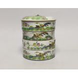 An early 20th century Chinese enamelled porcelain four section stacking food container and cover