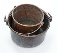 Two copper cauldrons with swing handles, the largest 43cm wide