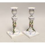 A pair of German porcelain candlesticks, marked JR, with applied floral decoration, 18cm