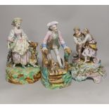 Three German porcelain figures including a Sitzendorf group of a young couple and a sheep,