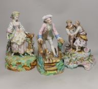 Three German porcelain figures including a Sitzendorf group of a young couple and a sheep,