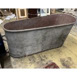 A vintage French galvanised bath, length 150cm, height 60cm