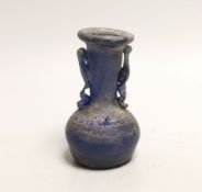 An 8th/9th century Islamic blue glass vase, 12cm