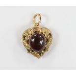 A Victorian yellow metal and cabochon garnet set heart shaped pendant, with glazed back, 21mm, gross