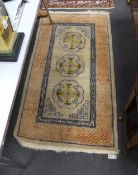 A Tibetan rug, 180 x 94cm