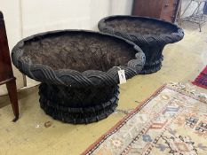 A large pair of circular weathered cast iron planters, diameter 82cm, height 43cm