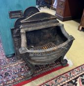 A 19th century cast iron bow front fire grate, width 56cm, depth 28cm, height 61cm together with a