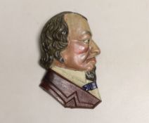 A painted iron Benjamin Disraeli plaque, 14cm high