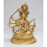A Sino Tibetan gilt bronze figure of Avalokiteshvara, 34cm high