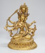 A Sino Tibetan gilt bronze figure of Avalokiteshvara, 34cm high