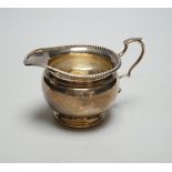 A George V silver cream jug, Harrods Ltd, Birmingham, 1931, 95 grams.