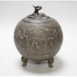 A Chinese three footed cast and chased bronze globular censer and cover, c.1900, 20cm high