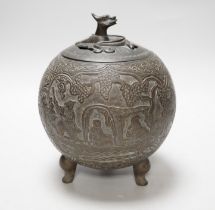 A Chinese three footed cast and chased bronze globular censer and cover, c.1900, 20cm high