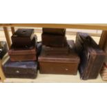 Seven vintage leather suitcases and a leather writing box (locked), the largest 60cm wide