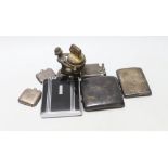 Two silver cigarette cases, two silver vesta cases and three other smoking related items.