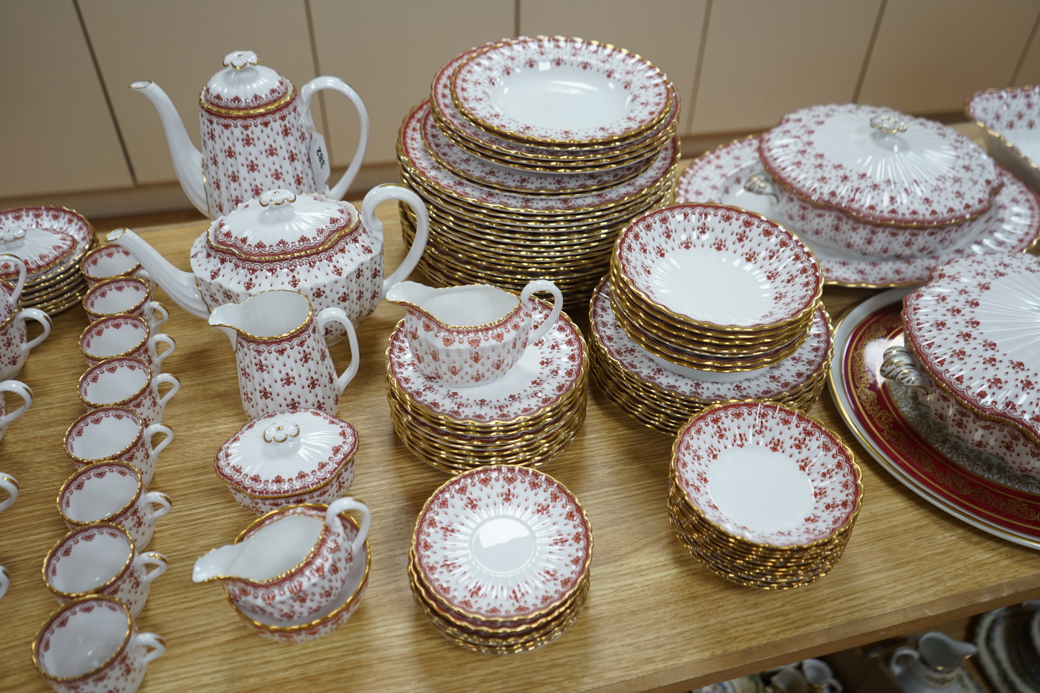 An extensive Spode fine bone china ‘Fleur De Lys Red’ tea, coffee and dinner service, including