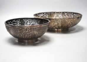 Two 19th century Chinese pierced white metal bowls, largest diameter 28.4cm, 22.7oz.