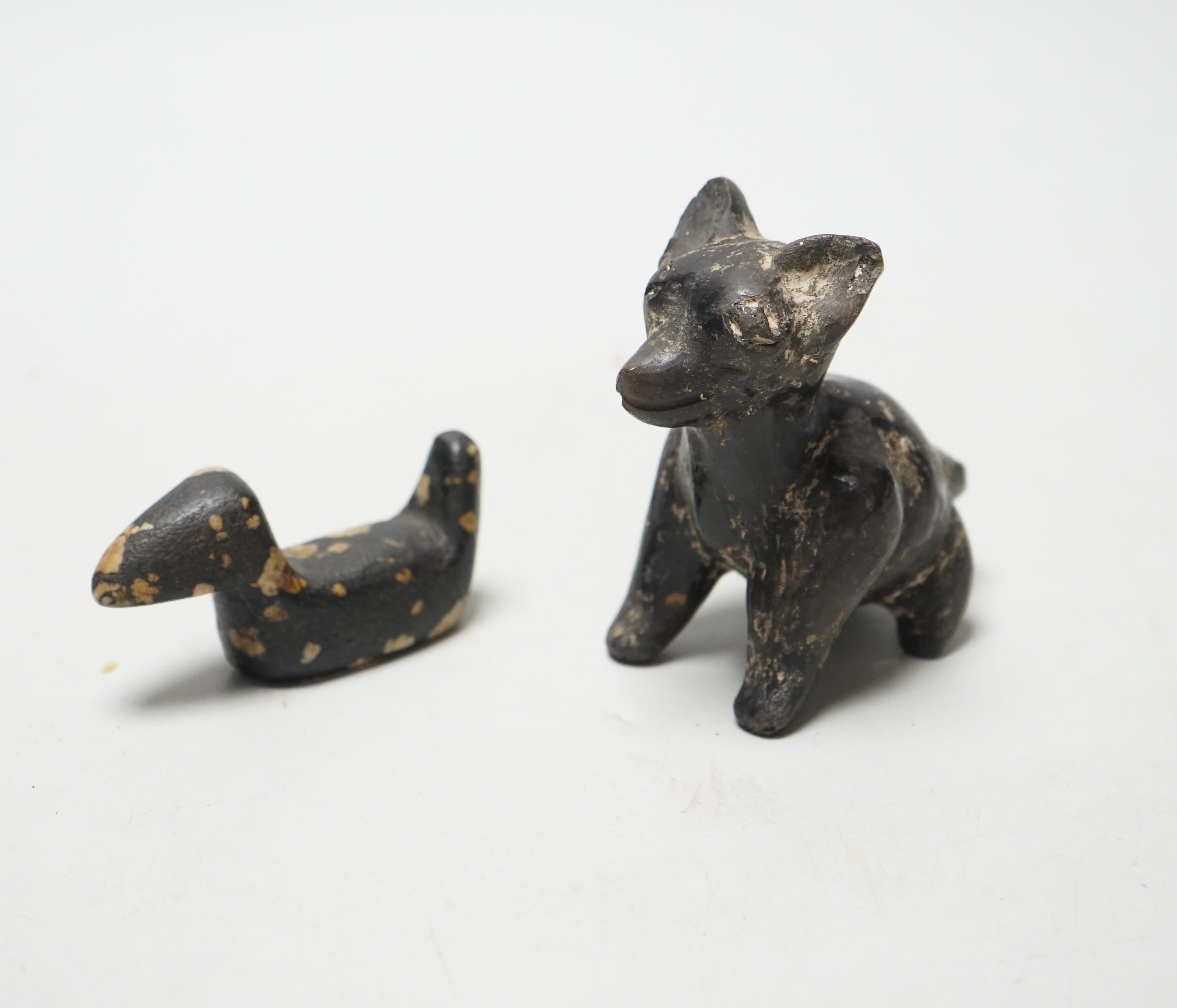 A pre-Columbian black glazed pottery figure of a fox, 9cm and a figure of a duck, 8cm