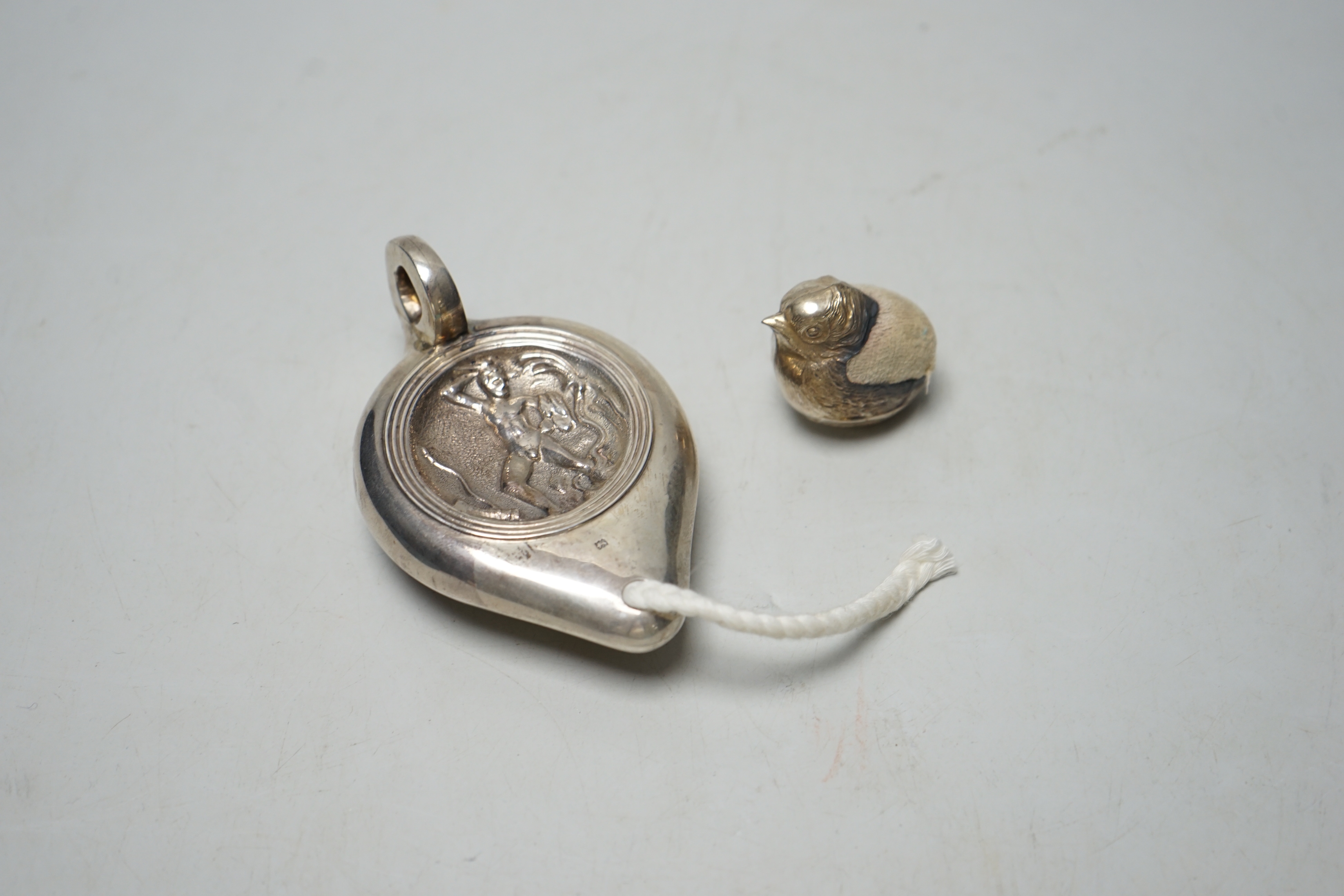 An Edwardian silver perpetual lighter, modelled as a lamp, embossed with figure, London, 1909, 91mm, - Image 2 of 3