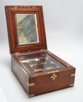 An Anglo-Indian wooden brass bound sewing box, with fitted interior and removable sections, hinged