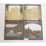 A quantity of magic lantern slides, stereograph slides and an album of 1920's photographs