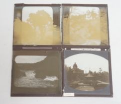 A quantity of magic lantern slides, stereograph slides and an album of 1920's photographs