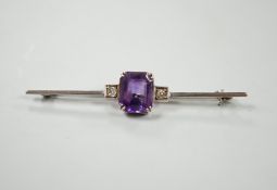 A 9ct white metal, amethyst and diamond set three stone bar brooch, 56mm, gross weight 3.7 grams,