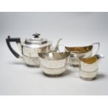 A late Victorian demi-fluted silver three piece tea set, John Milward Banks, Chester, 1898/1900