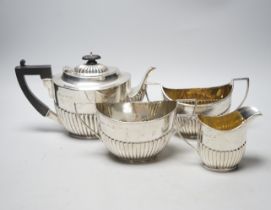 A late Victorian demi-fluted silver three piece tea set, John Milward Banks, Chester, 1898/1900