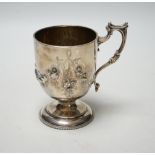 A Victorian embossed silver pedestal christening cup, Joseph Angell II, London, 1860, height 11.7cm,