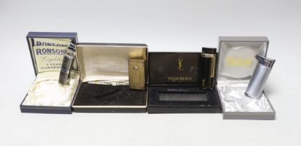 An Yves Saint Laurent lighter and three others, boxed