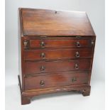 A 19th century miniature mahogany bureau, 38cm