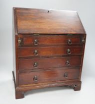 A 19th century miniature mahogany bureau, 38cm