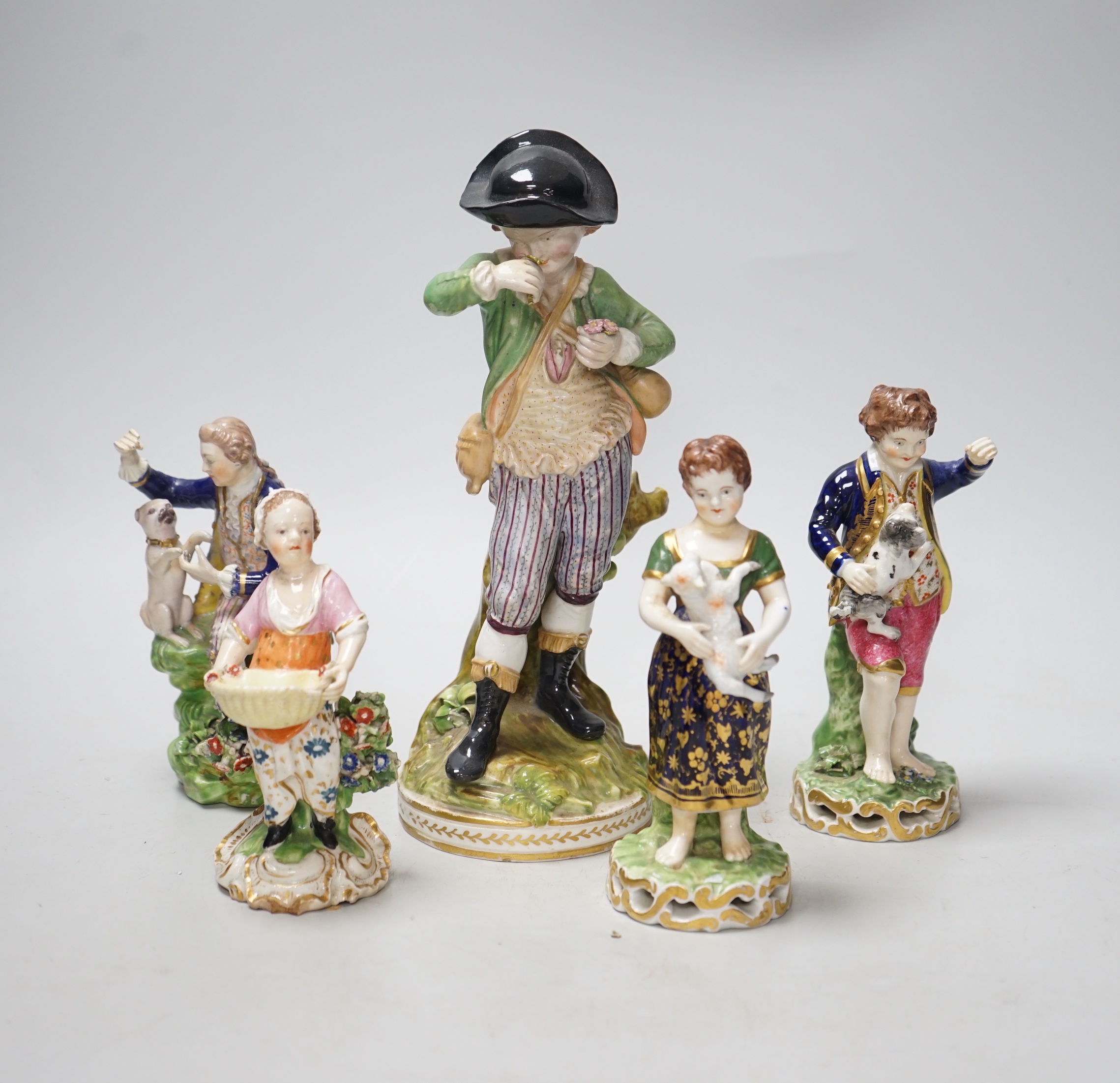 Four early 19th century Derby figures and an English porcelain figure in imitation of Derby, tallest