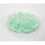 A Chinese yellow metal mounted carved jade oval brooch, 43mm, gross weight 15.8 grams