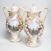 A pair of Jacob Petit style floral encrusted vases and covers, 39cm