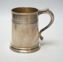 A George V silver mug, Stokes & Ireland Ltd, Chester, 1912, retailed by Harrods, 12.9cm, 15.4oz.