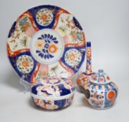 Nine Japanese Imari pieces including; a charger, lidded pot, a bowl, four small gourd vases, two