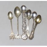 Six assorted small silver or white metal spoons including Tiffany & Co and a Millennium Hallmark