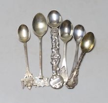 Six assorted small silver or white metal spoons including Tiffany & Co and a Millennium Hallmark