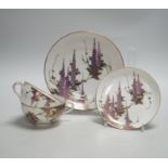 A Japanese part tea service with wisteria decoration, comprising of eight cups, eleven saucers and