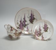 A Japanese part tea service with wisteria decoration, comprising of eight cups, eleven saucers and