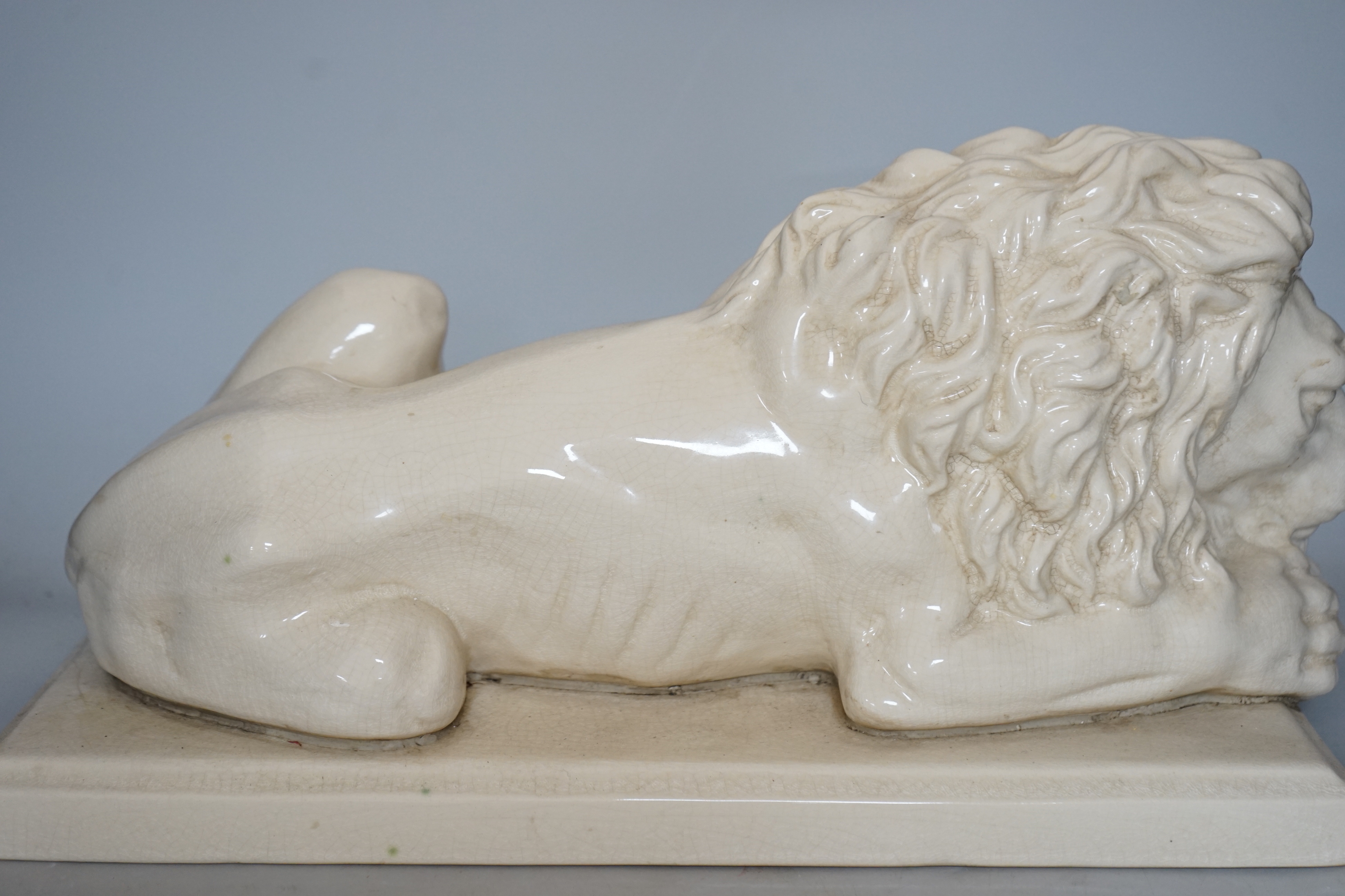 After Canova, a French cream crackleware pottery recumbent lion, 46cm wide - Image 3 of 3