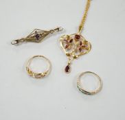 An early 20th century 9ct, garnet and seed pearl set drop pendant, overall 45mm, on a yellow metal