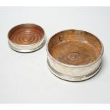 Two modern silver mounted wine coasters, largest diameter 12.5cm.