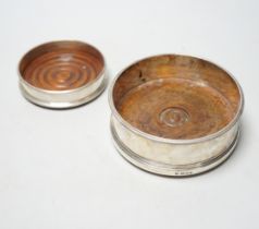 Two modern silver mounted wine coasters, largest diameter 12.5cm.