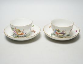 A pair of Meissen tea bowls and saucers, c.1770, hand painted with fruit, saucers 13.5cm in