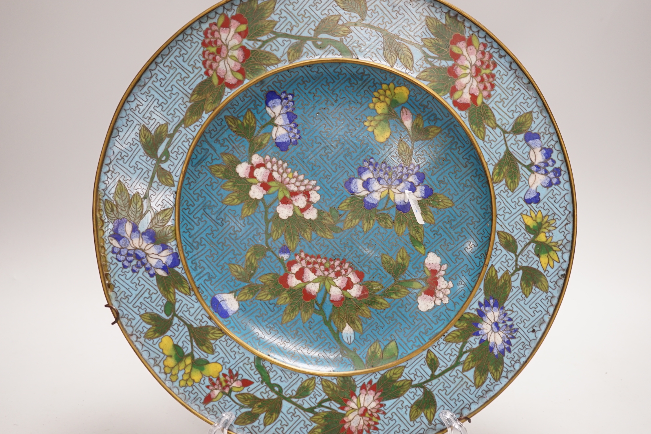 A Chinese Jiaqing period cloisonné enamel dish on a turquoise ground with floral decoration, 27.5cm - Image 2 of 3